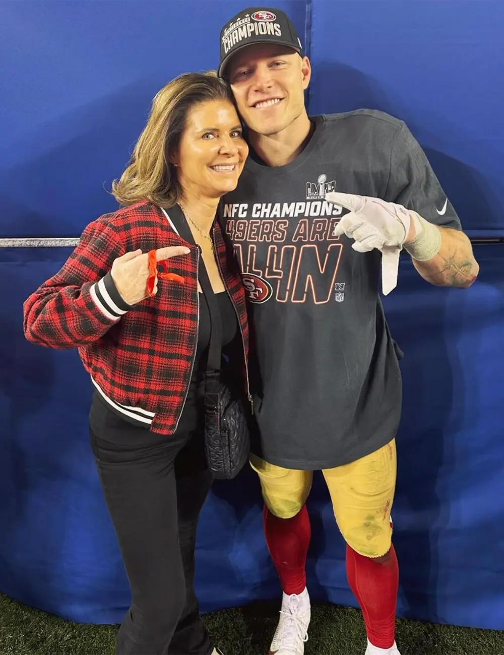 Christian McCaffrey and his mom Lisa celebrate after the 49ers beat the Lions to punch their ticket to the Super Bowl on Jan. 28, 2024. 